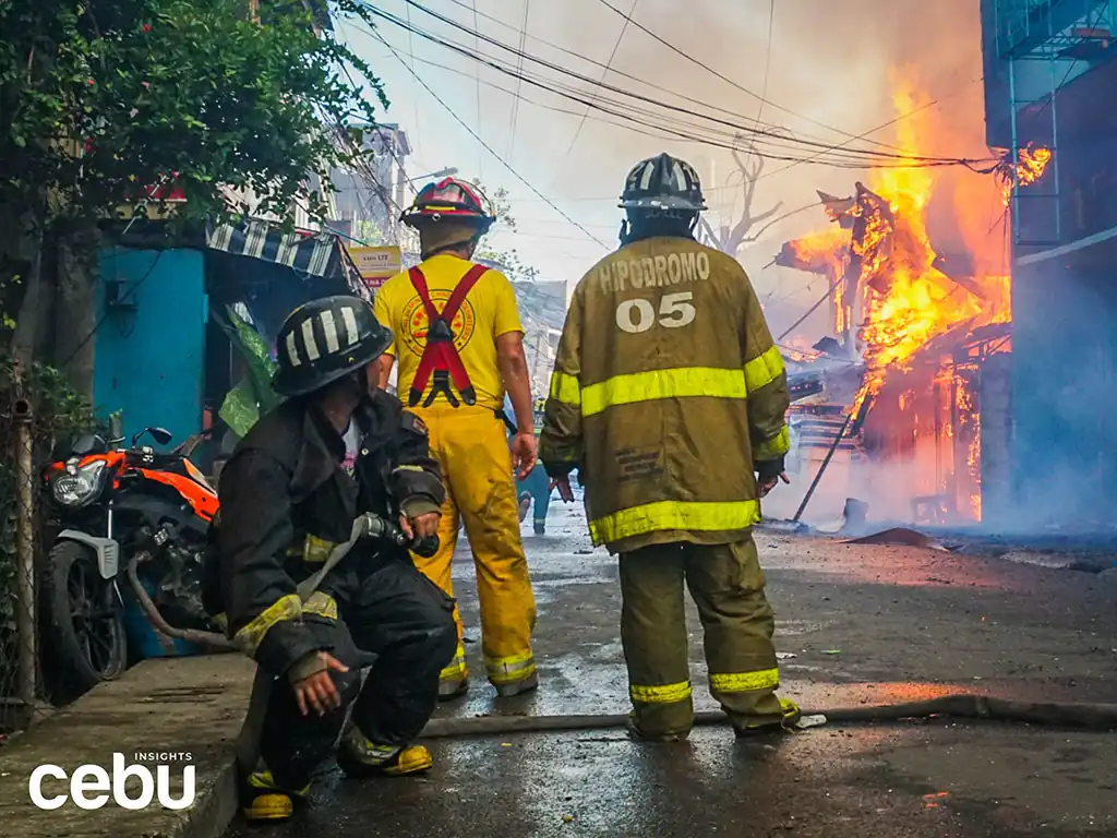 firemen putting out house fires in Cebu City