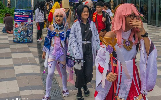Cosplayers walking along the Sky Park during the Otakufest 2023