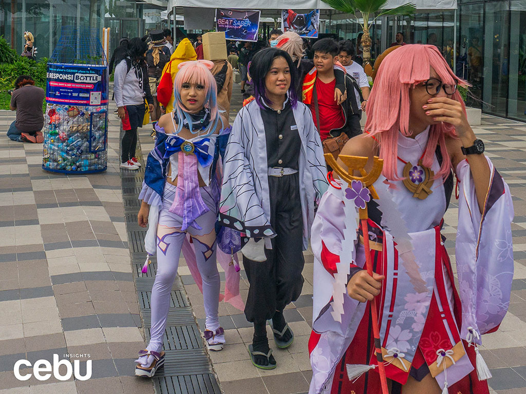 Cosplayers walking along the Sky Park during the Otakufest 2023