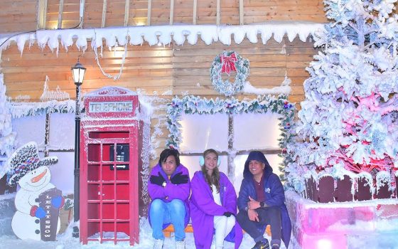 Three people posing at the Snow World in Anjo World