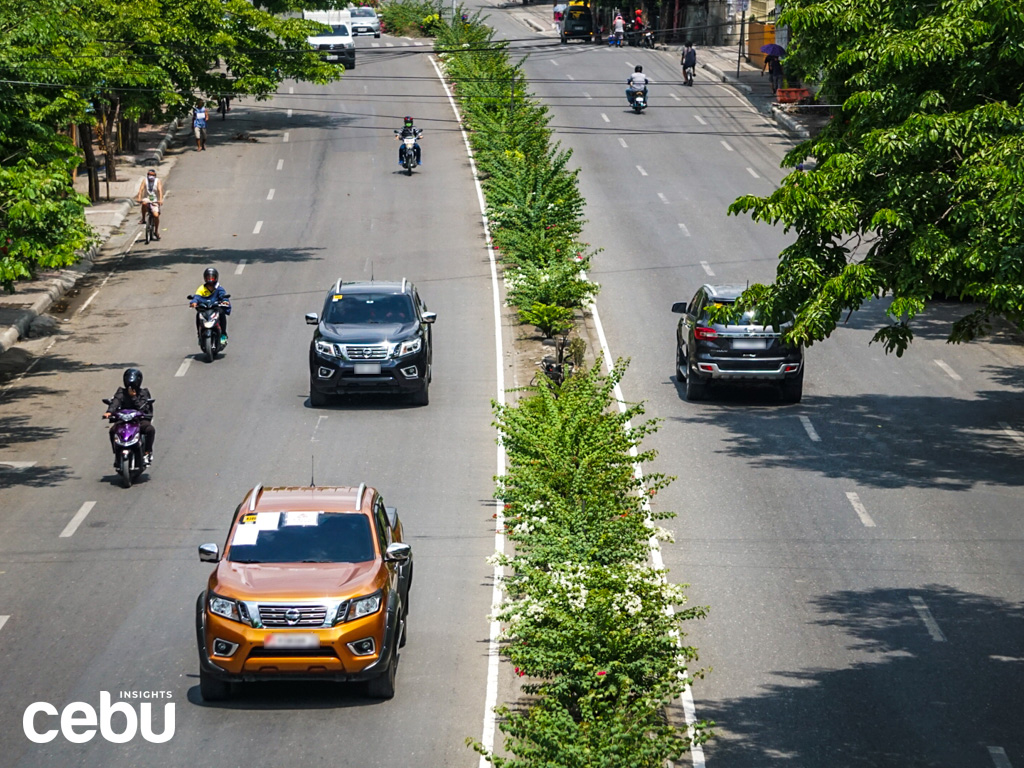 Cars cruising down the streets of Cebu City