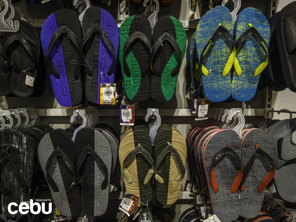 Islander slippers on a department store rack